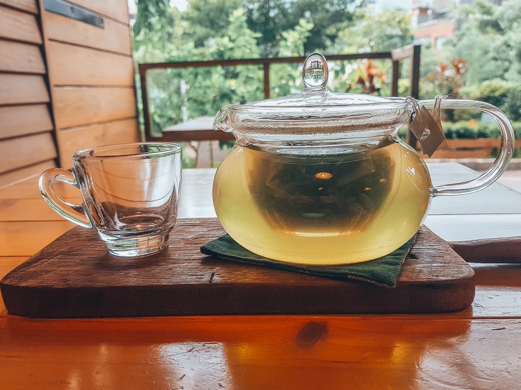 green tea brewing in glass