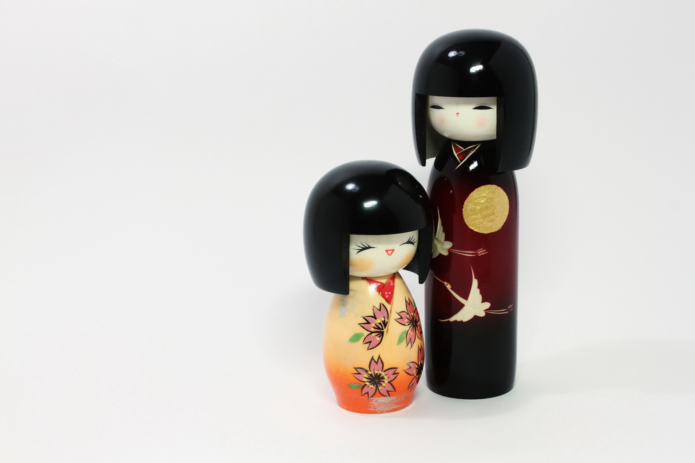 Japanese dolls (boy and girl) on the white background